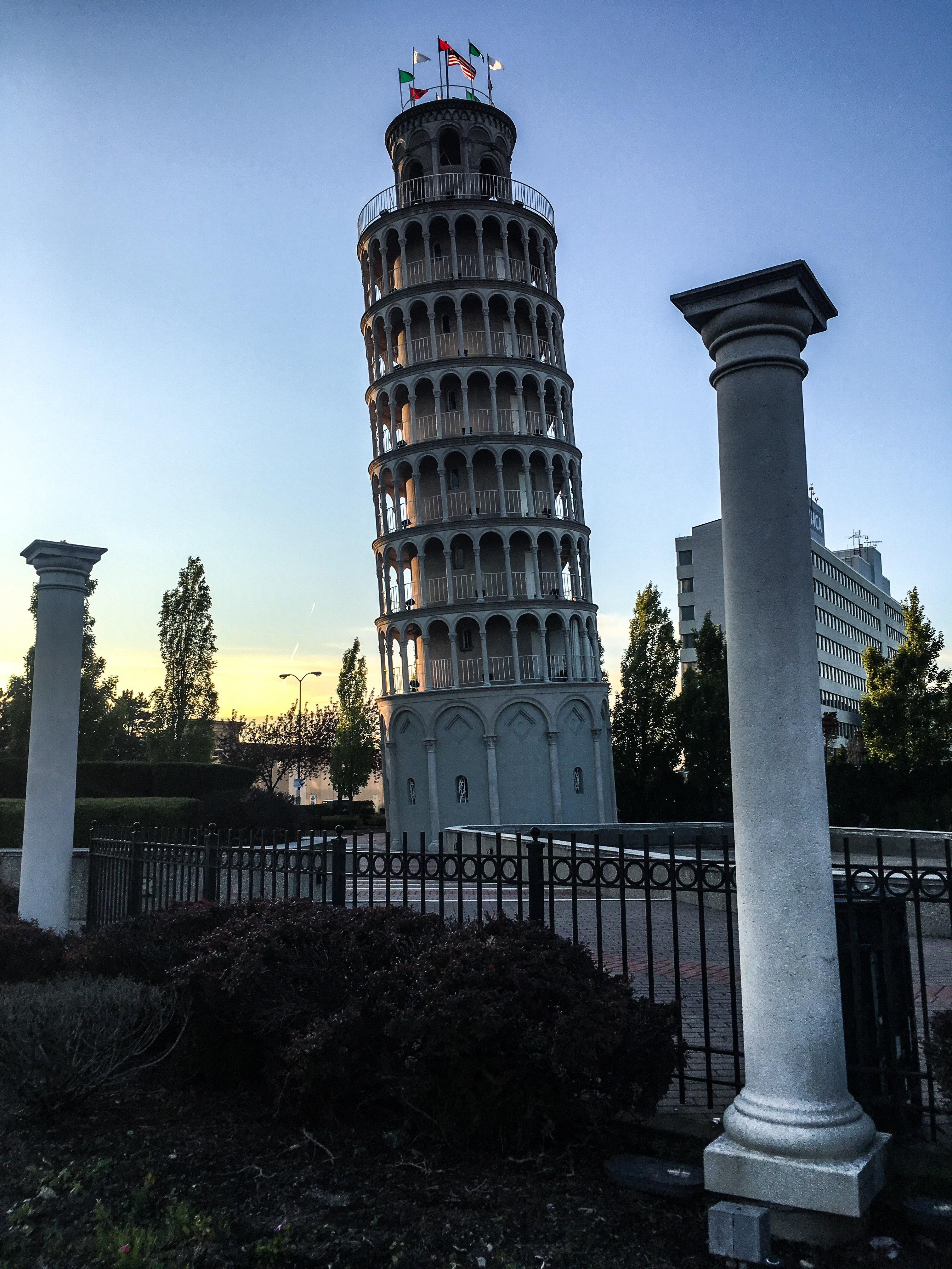 a tower with columns and a fence