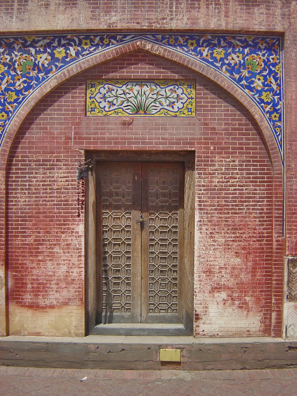 a door with a floral design on the wall