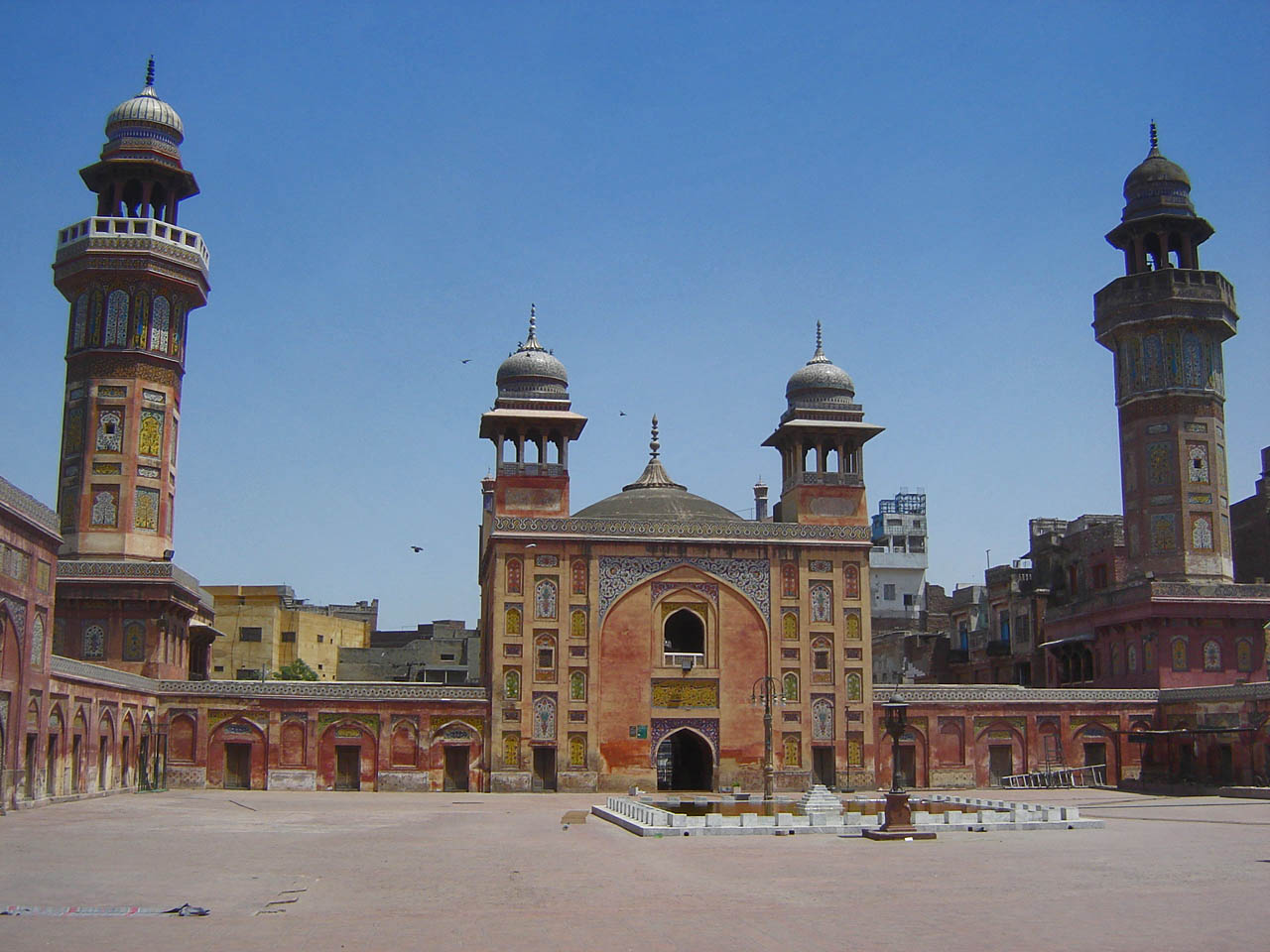 Wazir Khan Mosque with towers and a fountain
