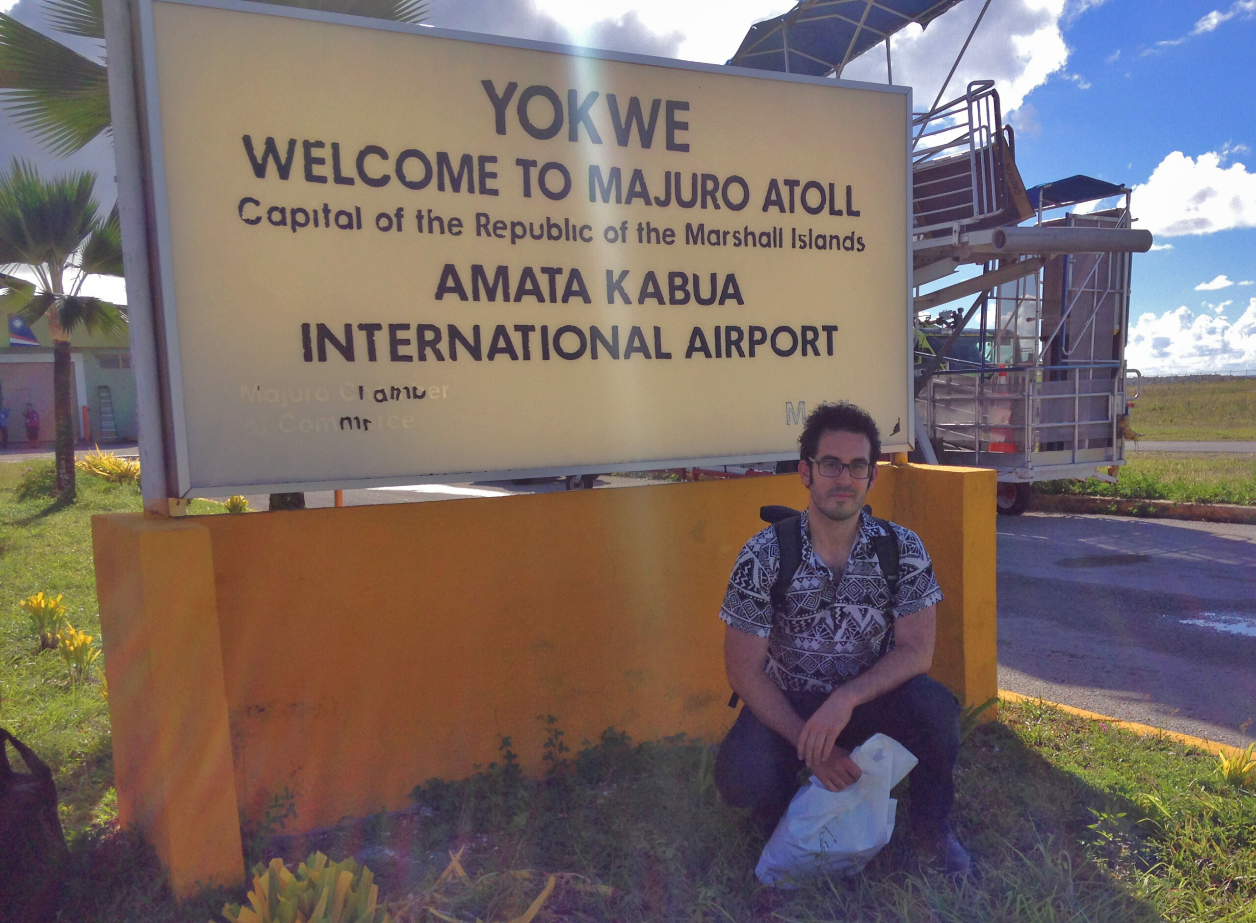 Posing at Majuro Airport Welcome Sign