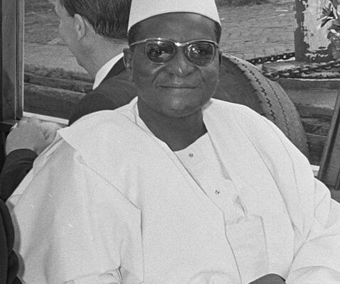 a man wearing a white hat and sunglasses