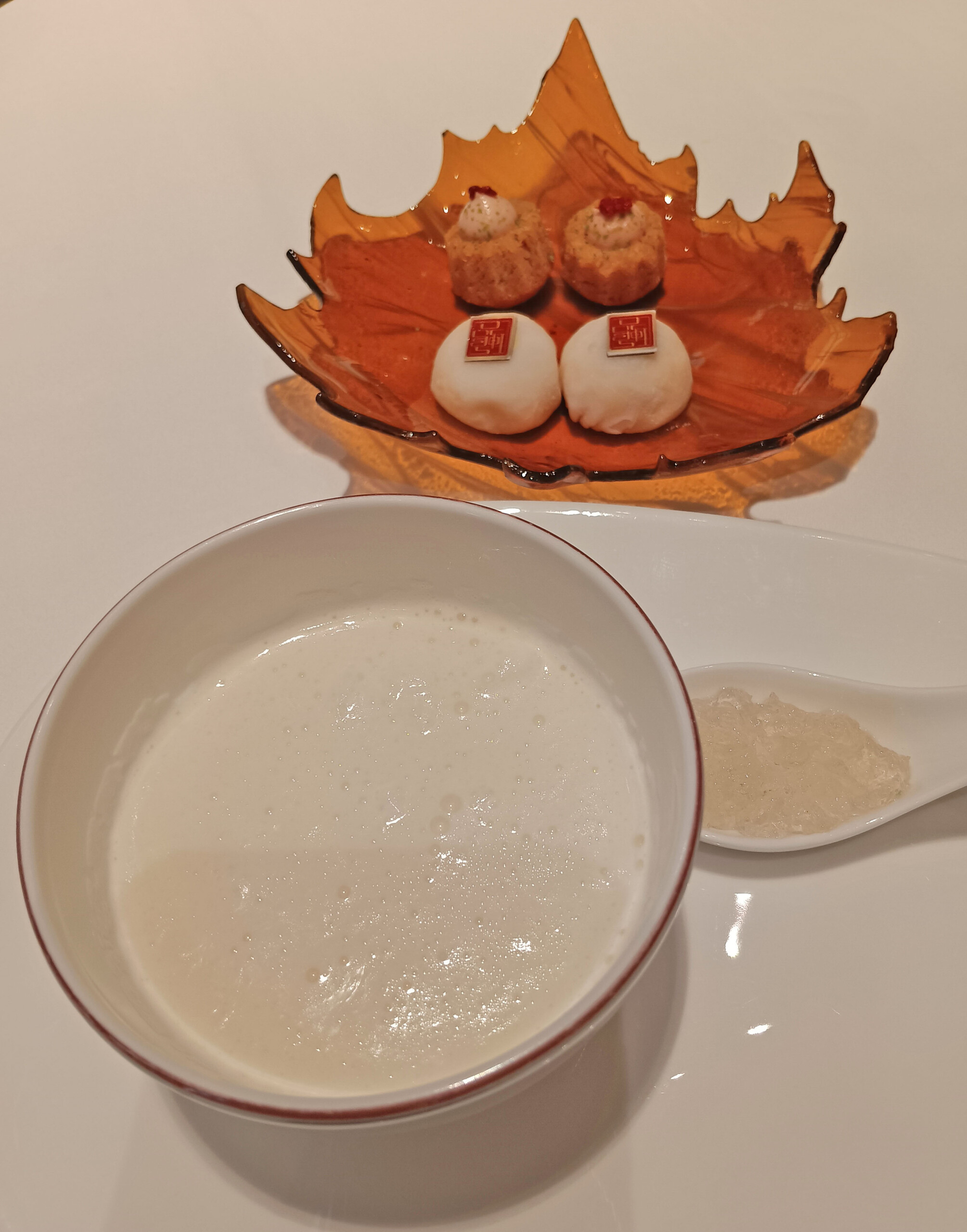 Almond pudding with bird's nest, and two cookies