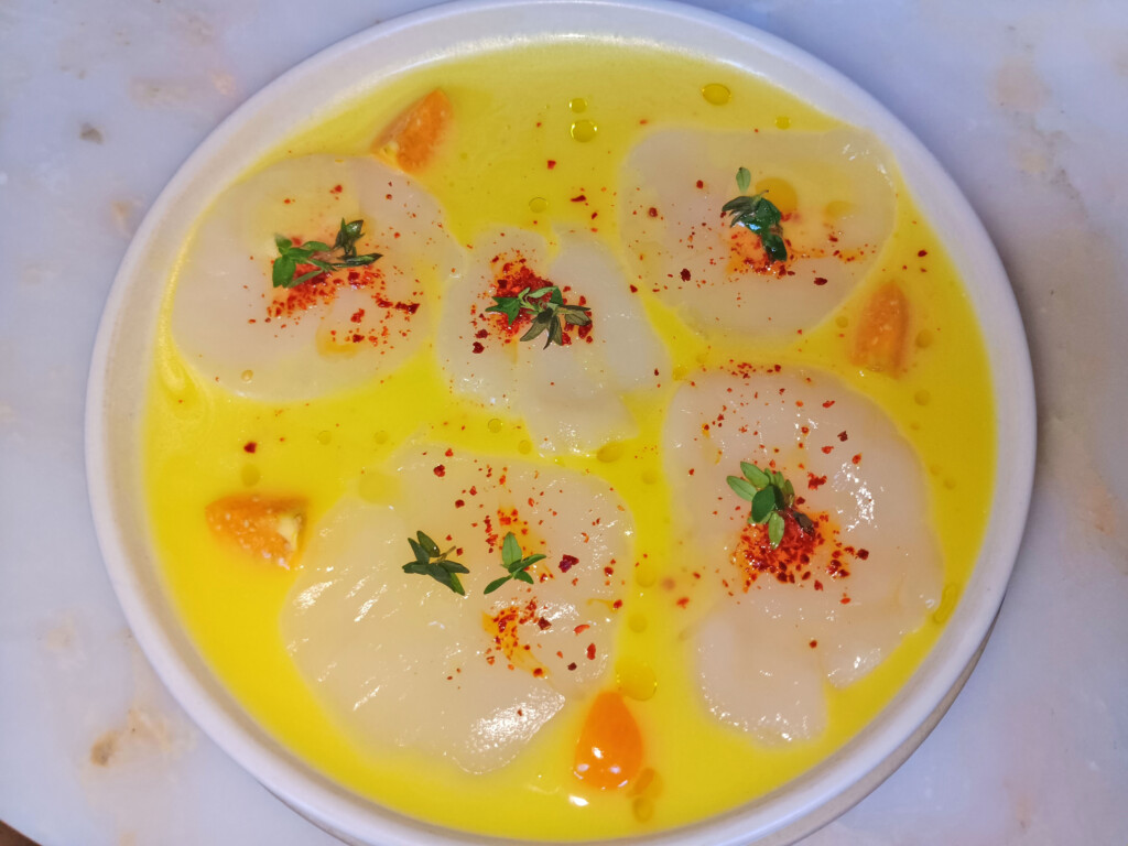 Scallop crudo -- golden berry, habanero broth, thyme