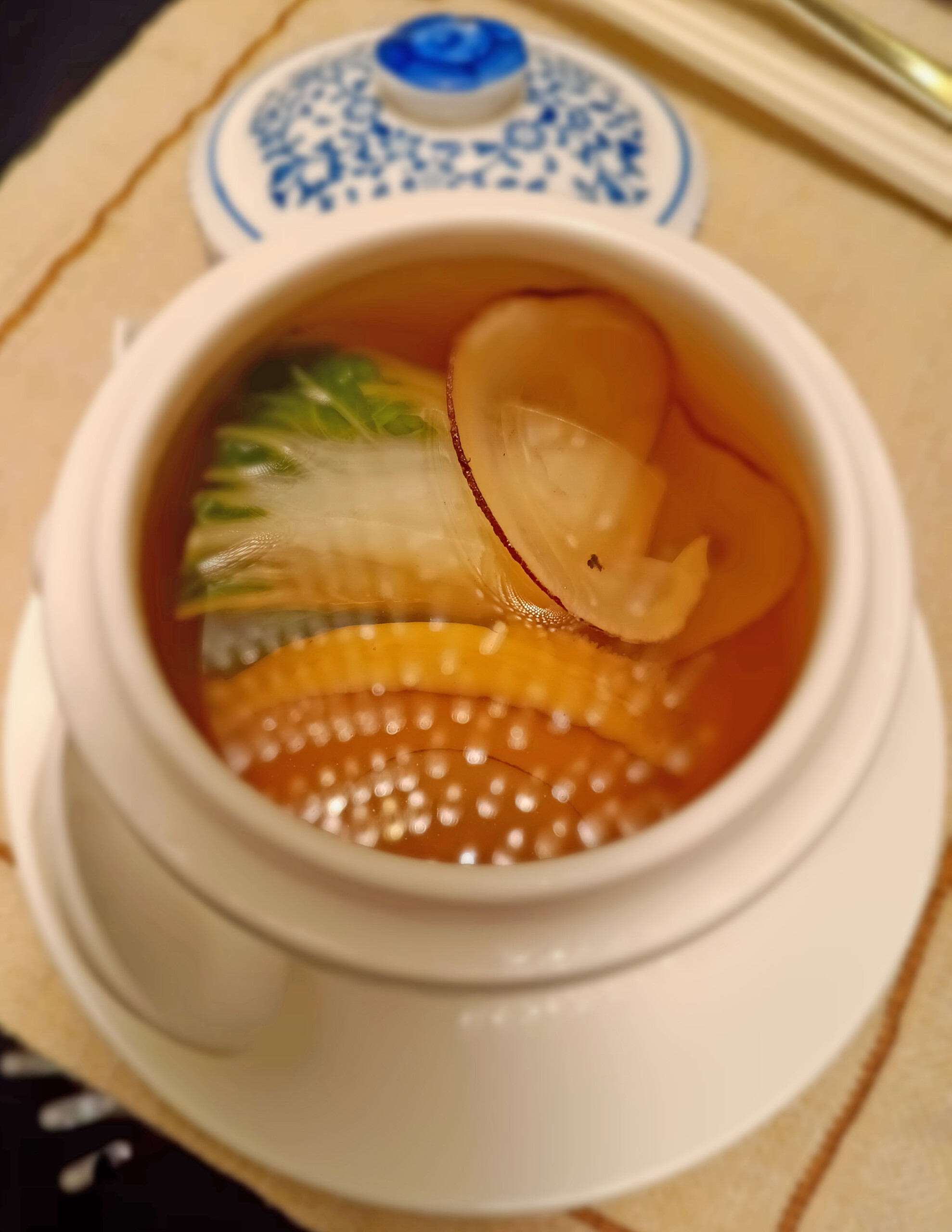 Double-boiled abalone soup with sea coconut and bok choy