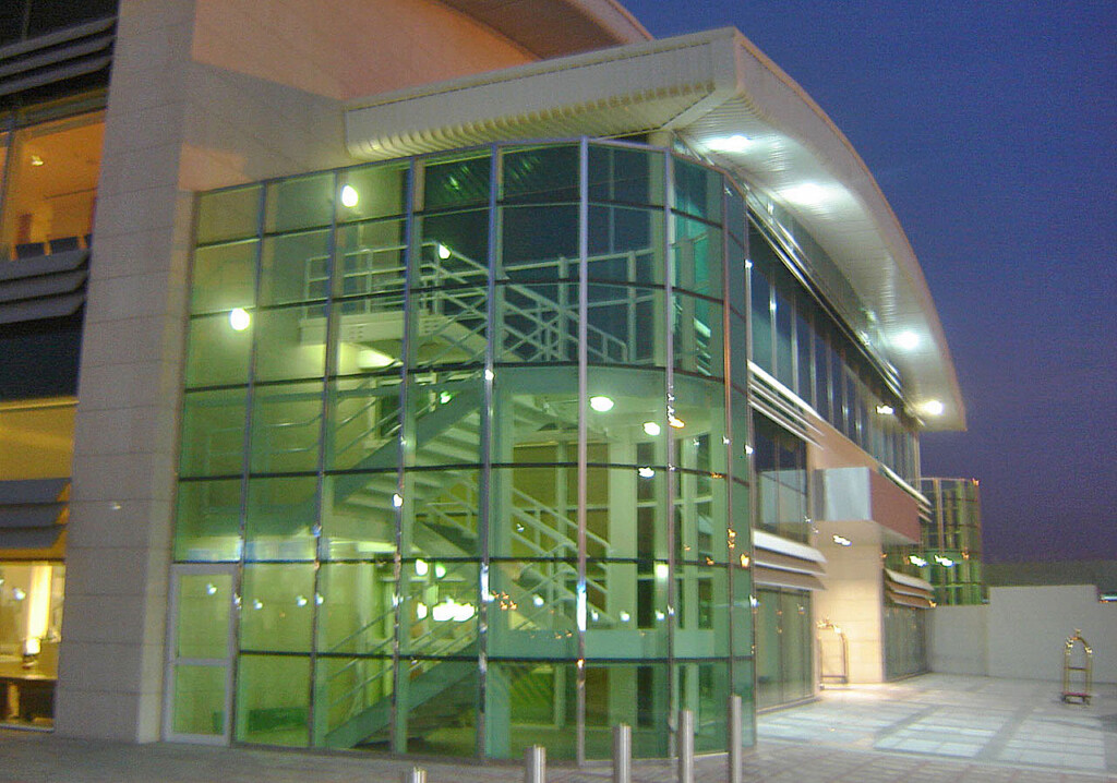 a building with glass walls and stairs