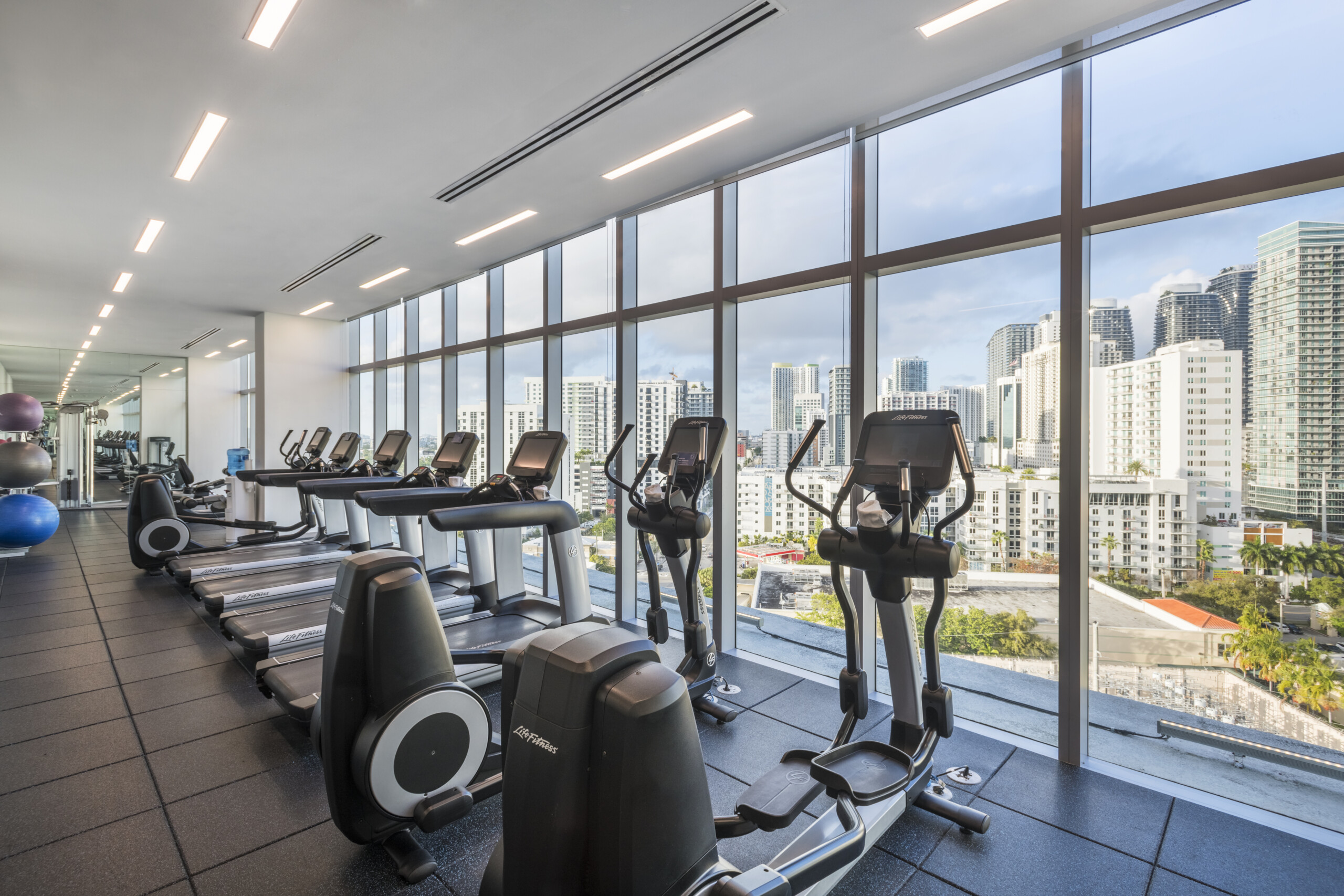 a room with treadmills and exercise machines