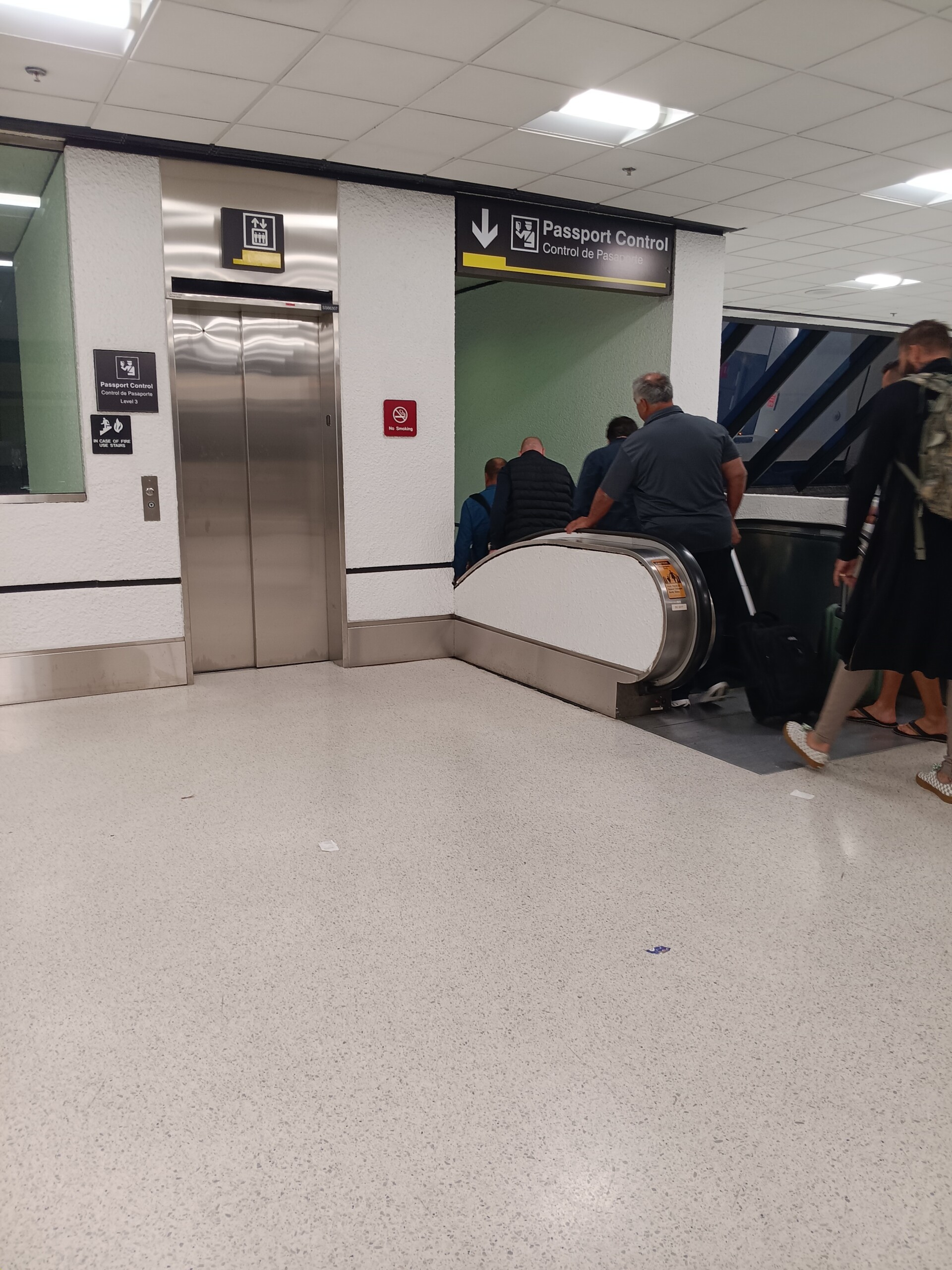 One Small Elevator and One Narrow Escalator to Passport Control