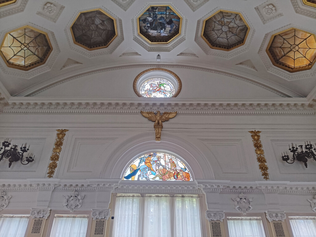 a ceiling with stained glass windows