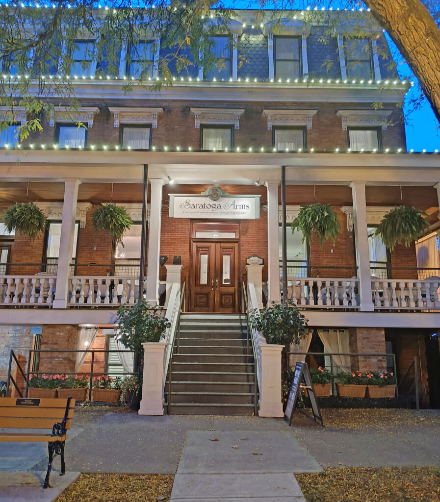 a building with a tree and stairs