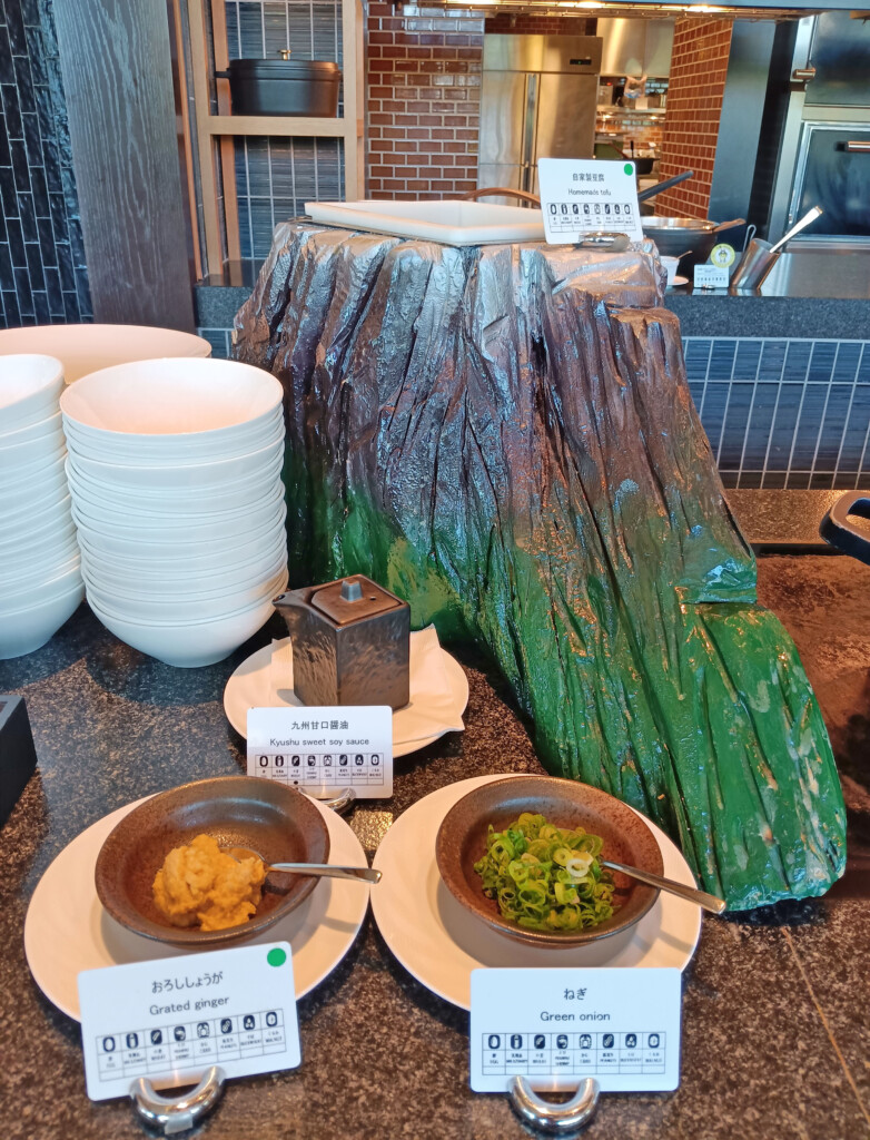 a table with plates and bowls of food