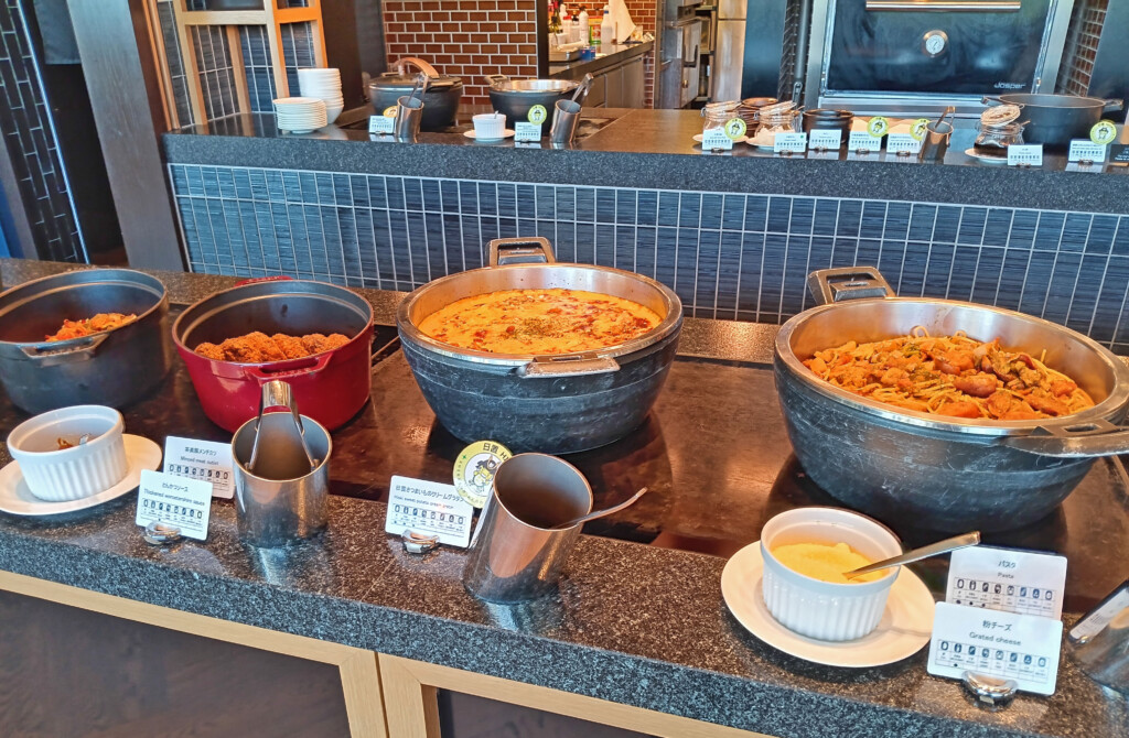 a buffet table with food in bowls