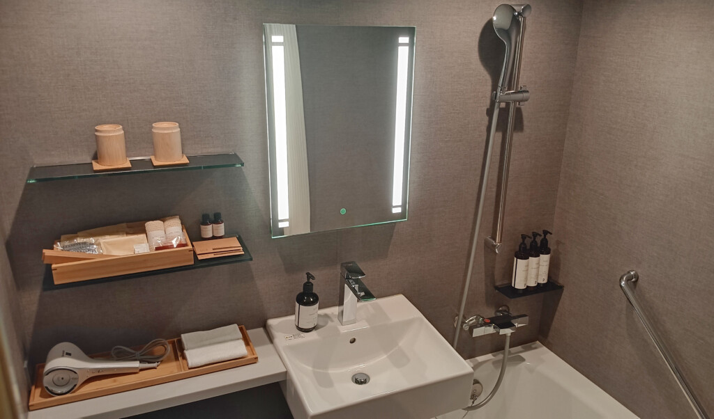 a bathroom with a mirror and a sink