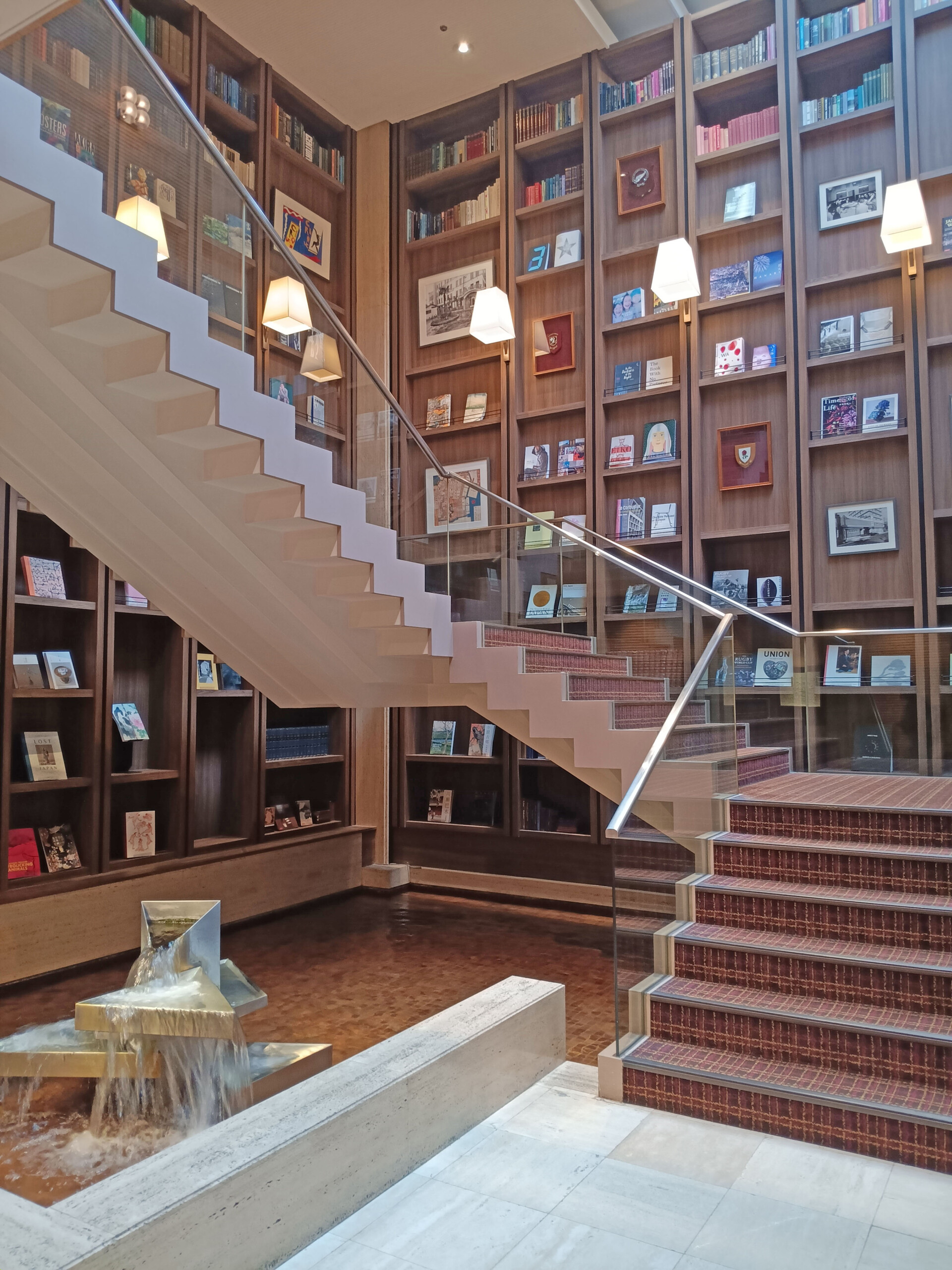 Hotel Staircase Adjoined by Books