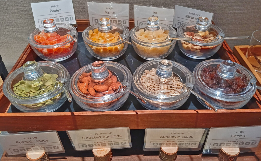 a group of glass containers with different types of food