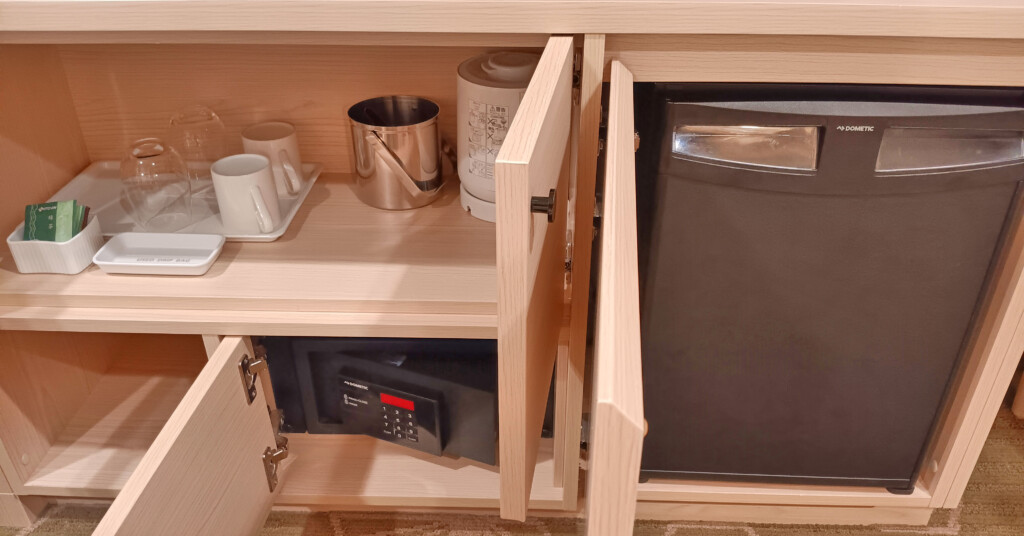 a kitchen cabinet with open doors