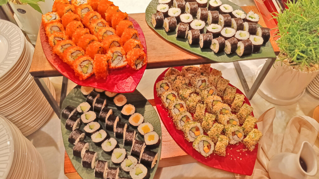 a trays of sushi on a table