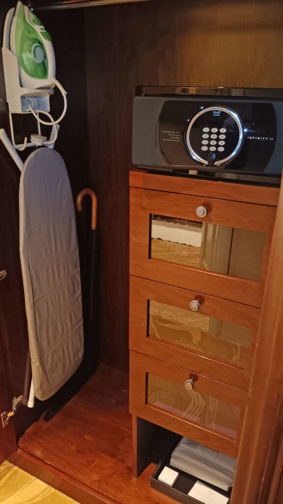 a ironing board and a black electronic device