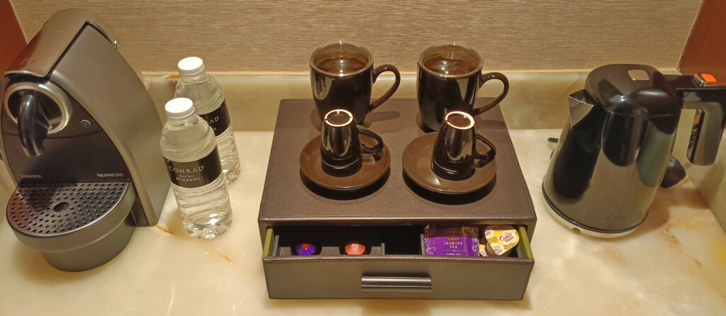 a tray with coffee cups and saucers