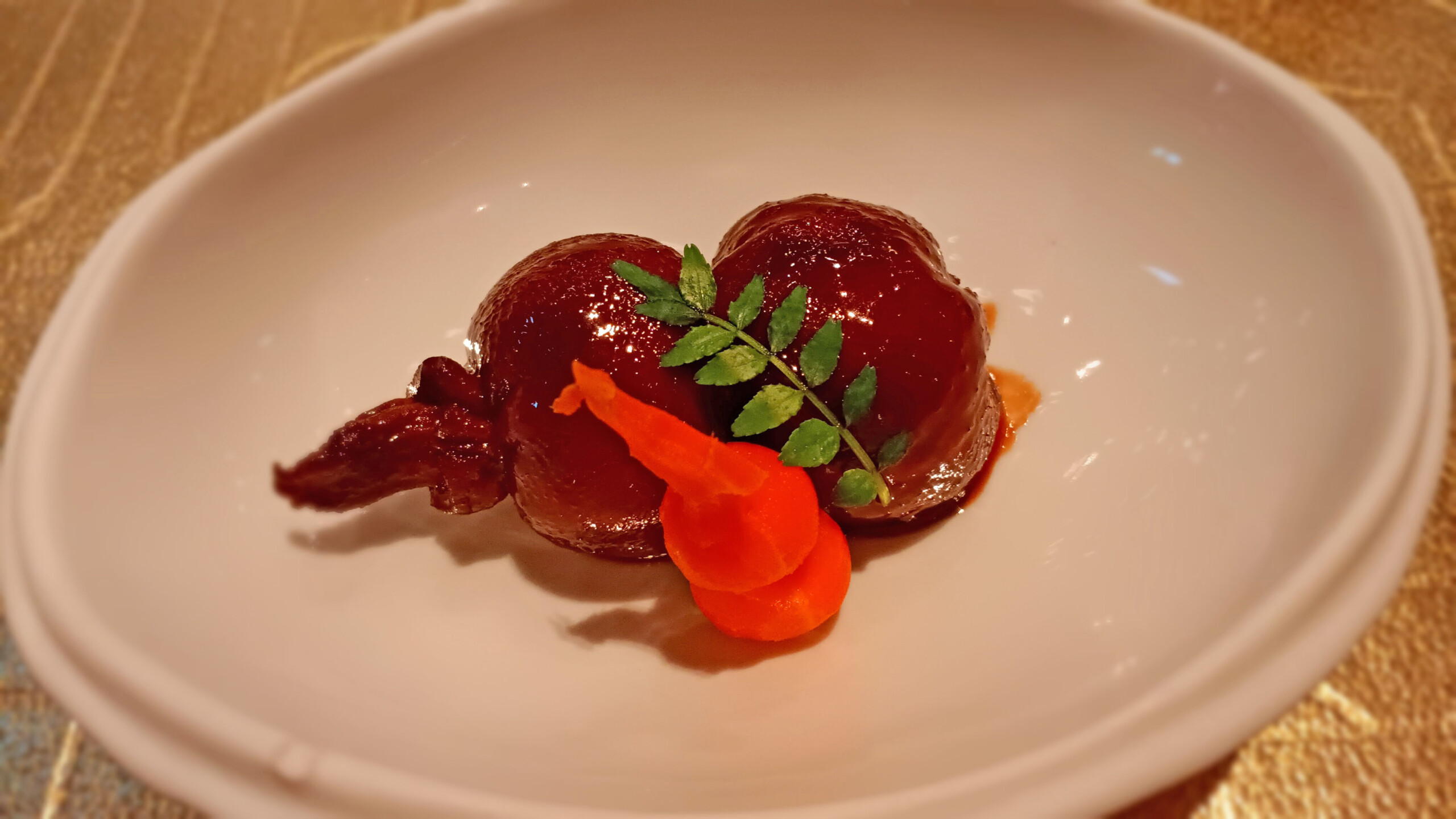 a plate of food with a leafy branch