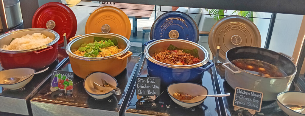a group of pots with food in them