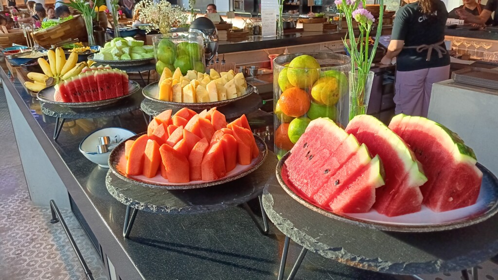 a group of plates of fruit on a table