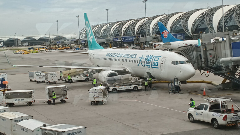 I am using this shot of the plane from Bangkok Airport since I didn't get a good view at HKG