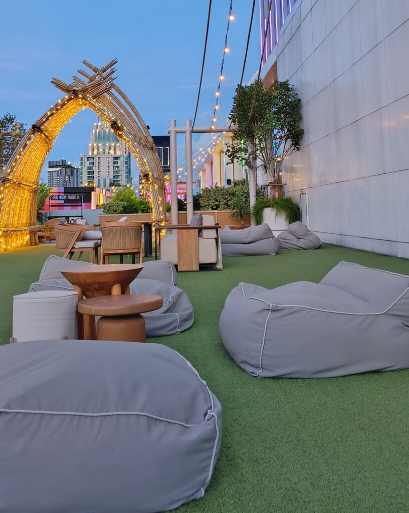 a group of bean bags on a green area