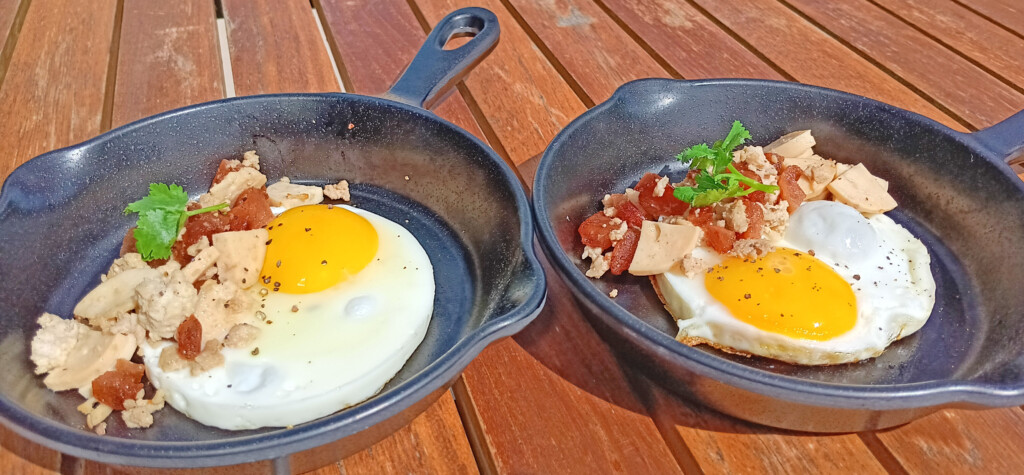 two pans with food on them