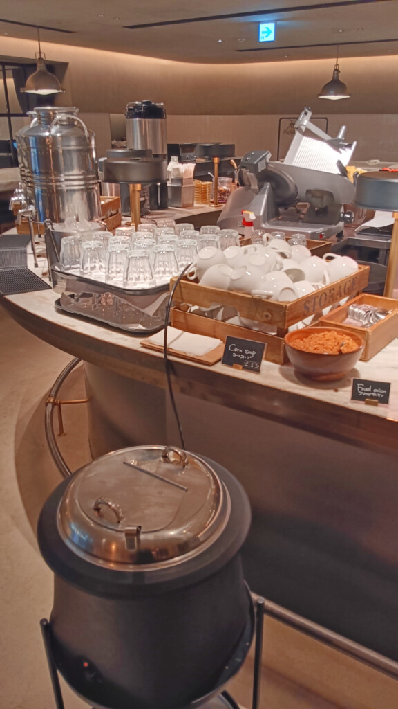 a counter with a group of dishes and cups