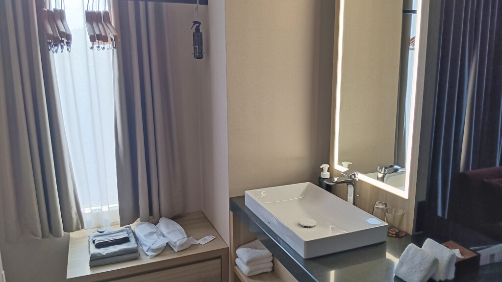 Vanity with Hangars, Robe, and Slippers