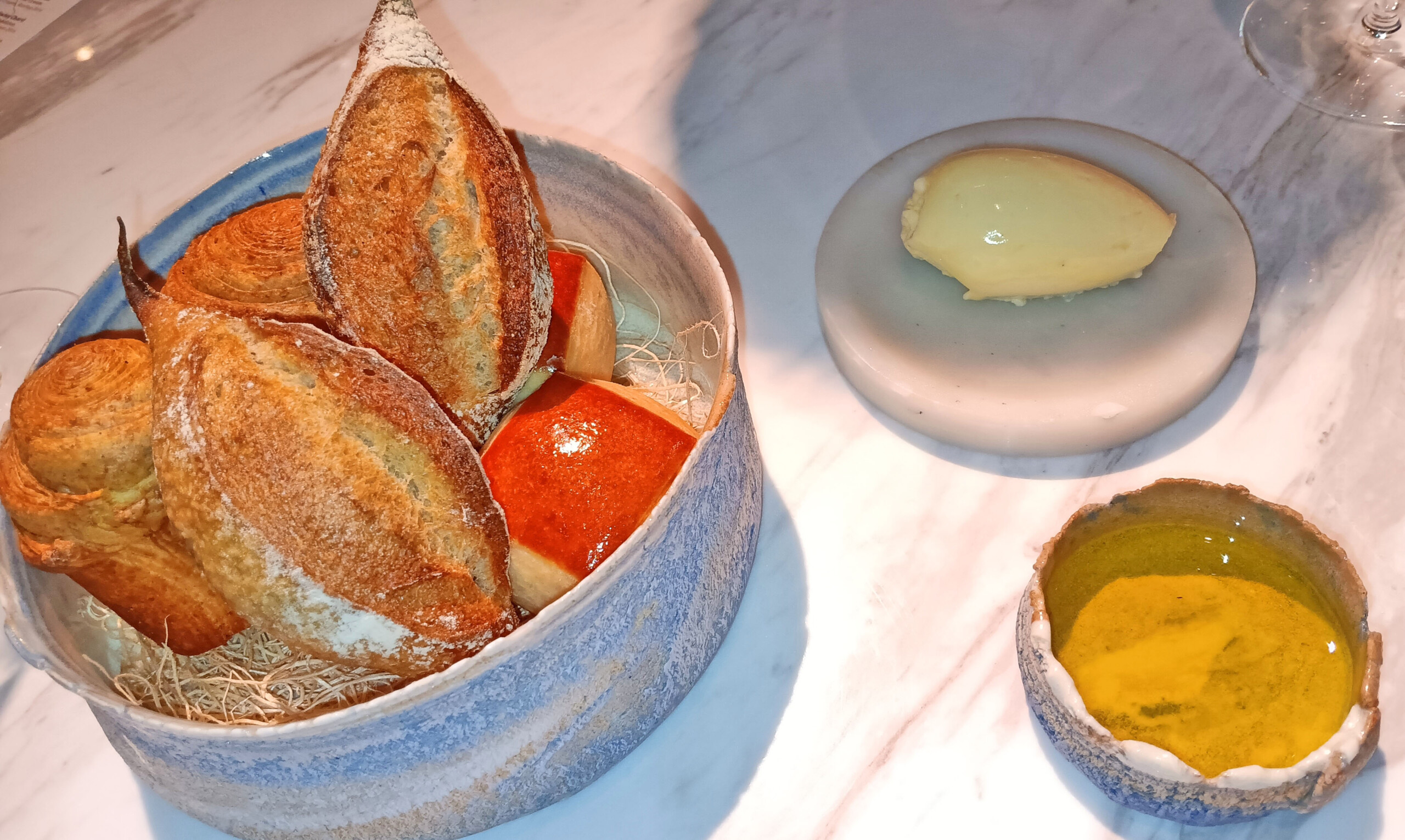 Wonderful house-made bread with ice cream-scooped butter