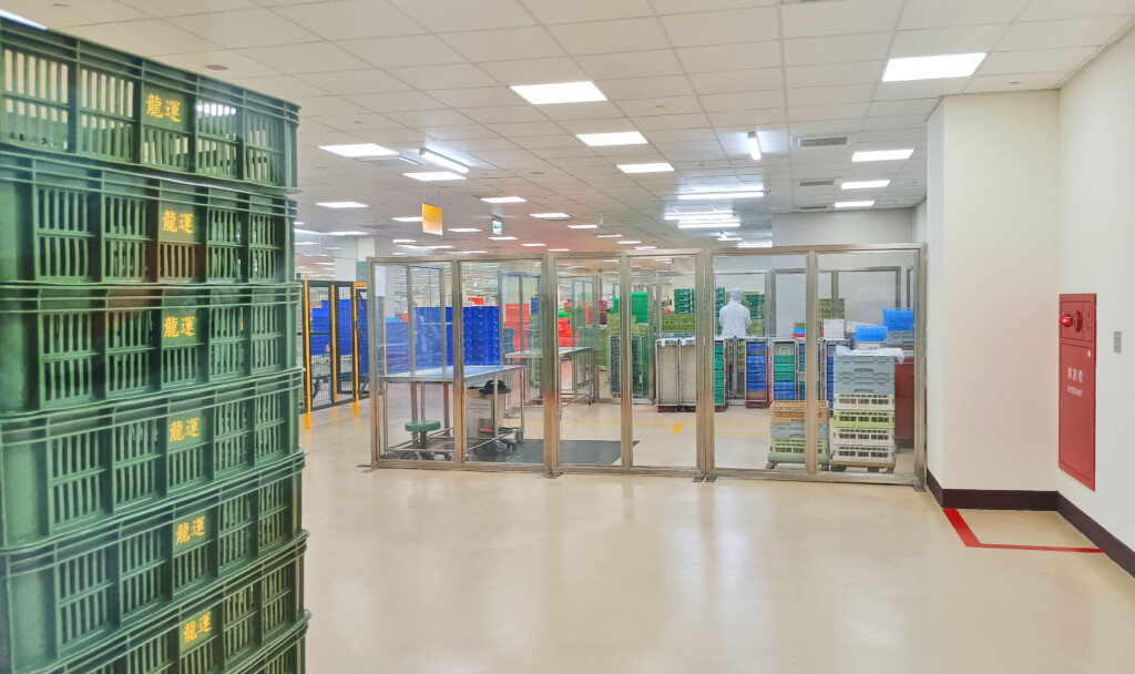 a room with shelves of crates and crates