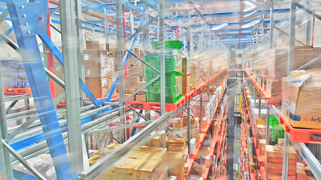 a warehouse with boxes on shelves
