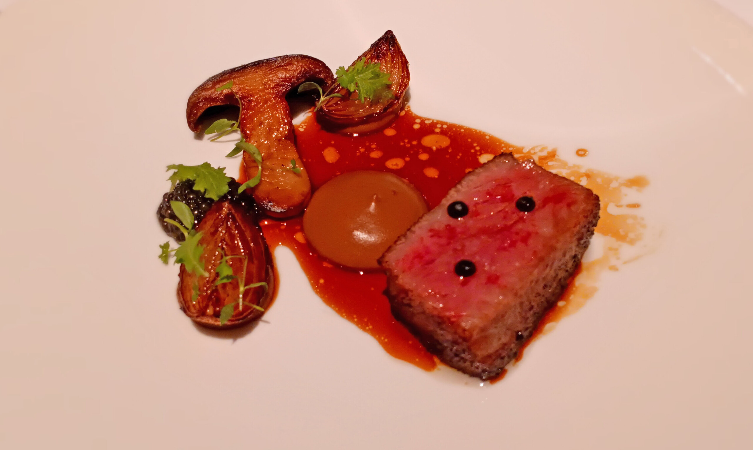 Charcoal-grilled Niigata Murakami beef with porcini, Pecoros onion, smoked caviar
