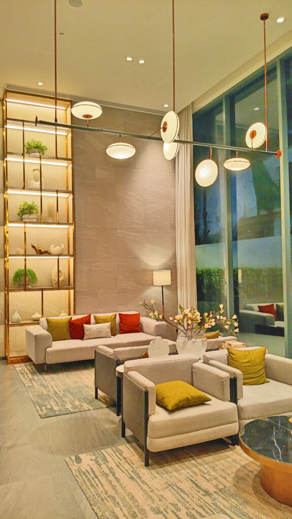 a living room with couches and a shelf