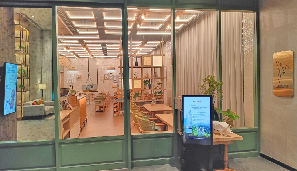 a room with a screen and a computer