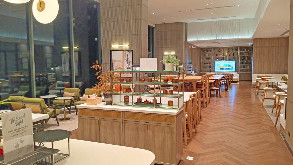 a room with a large television and tables