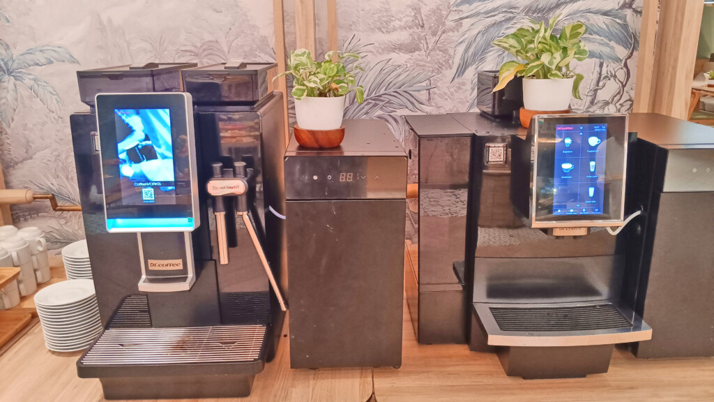 a black machine with a plant on top