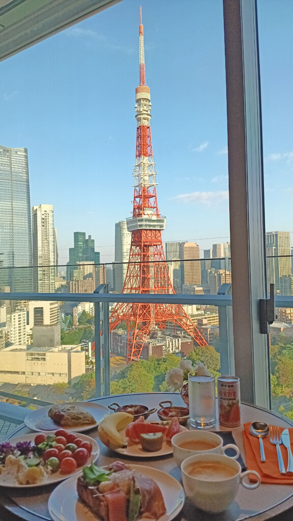 a table with food on it and a tower in the background