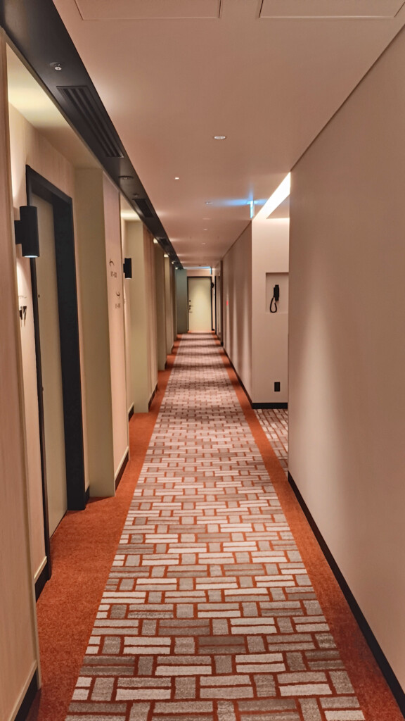 a long hallway with brick flooring