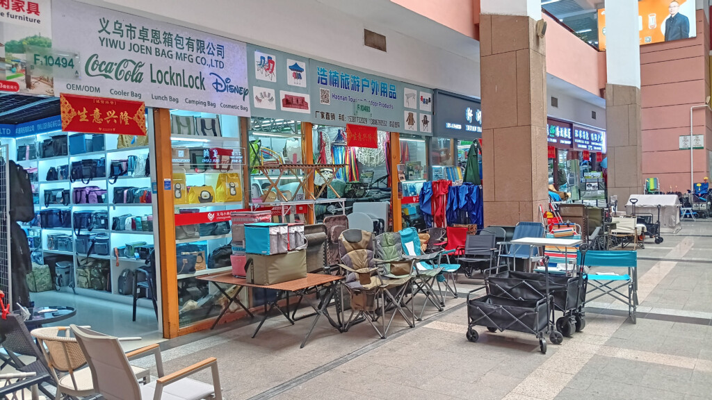 a storefront with chairs and tables