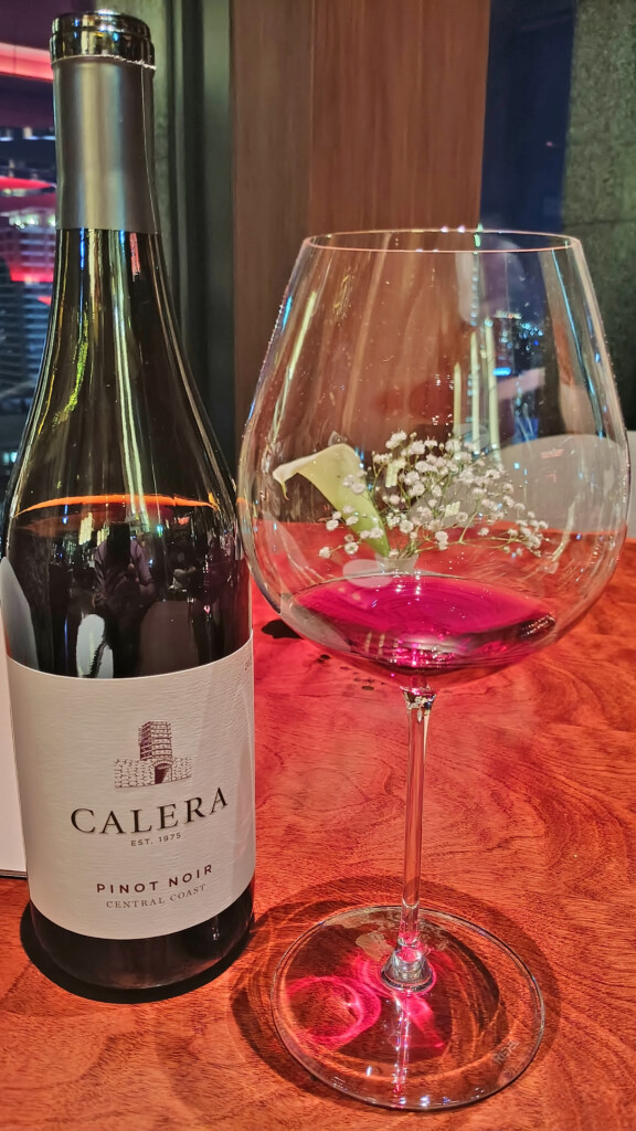 a wine bottle and a glass of wine