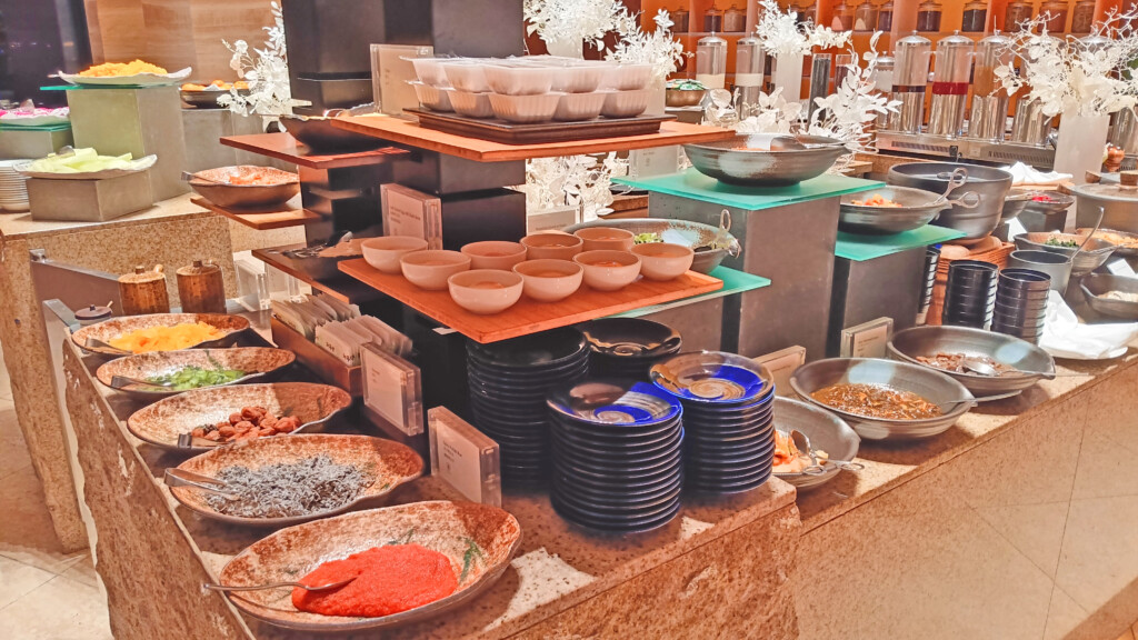 a buffet with different dishes and bowls