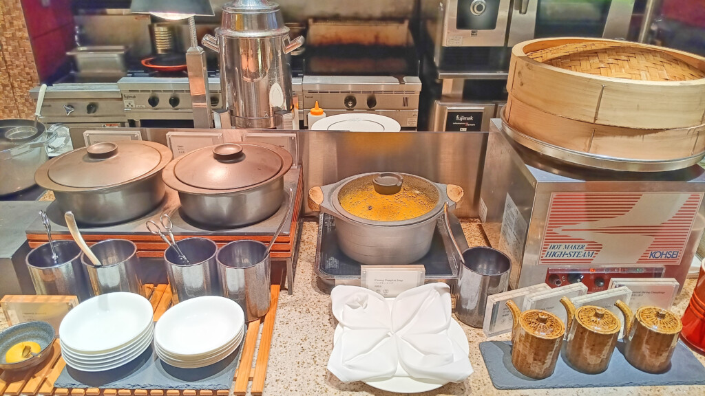 a kitchen with a variety of pots and pans