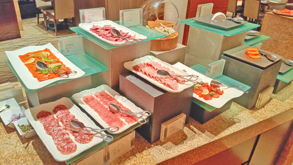 a buffet table with different types of meat