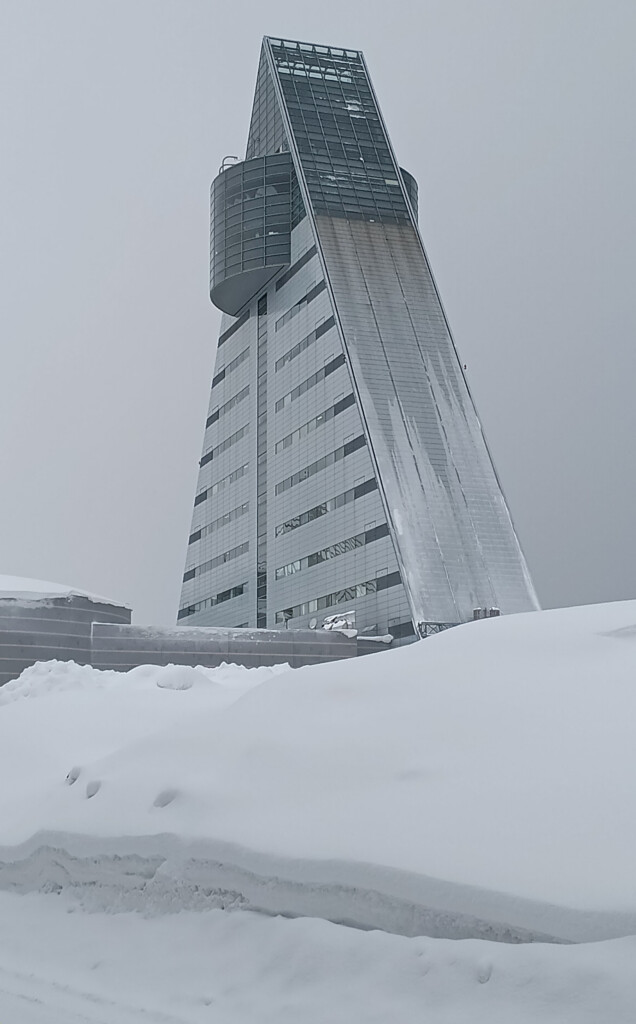 a tall building with snow