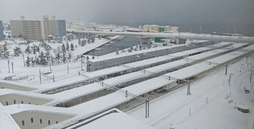 a train station covered in snow