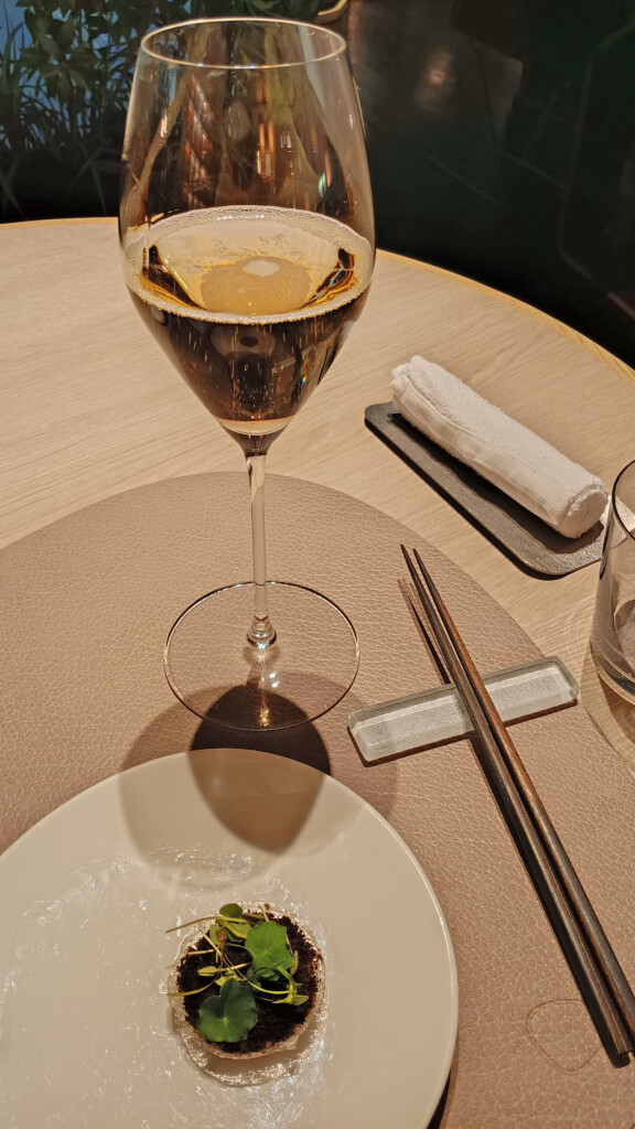 a glass of wine on a table