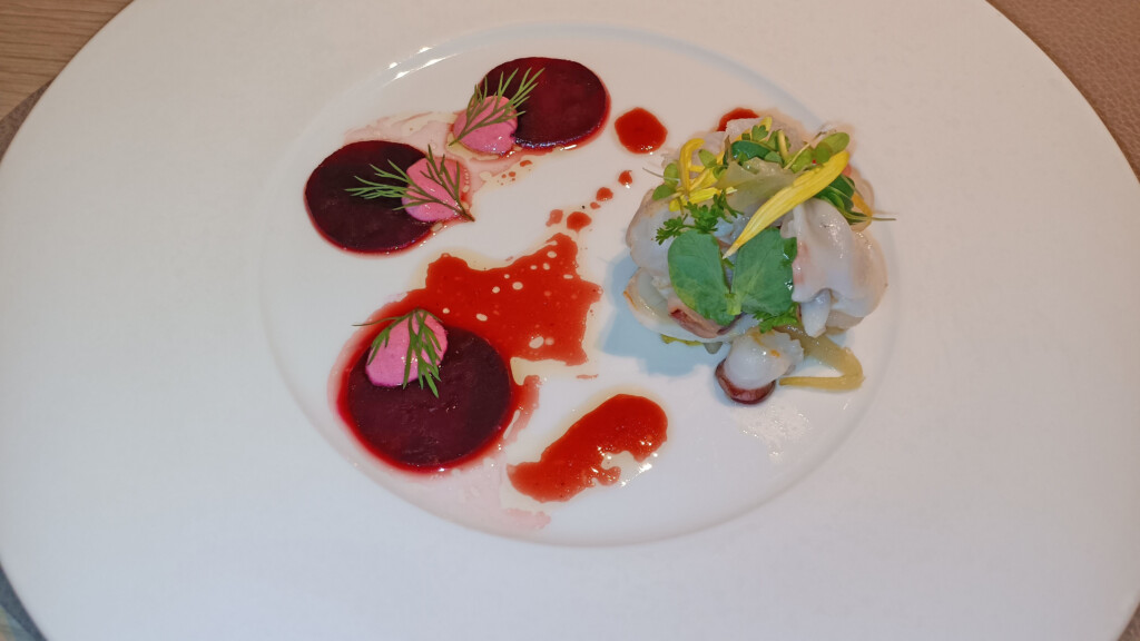 a plate of food on a white surface