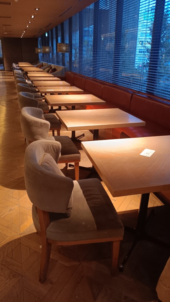 a row of tables and chairs in a restaurant
